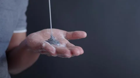 Shampoo on hand light gray background. Stock Footage 252709934