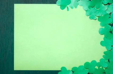 Shamrocks on a blank paper sheet Stock Photos