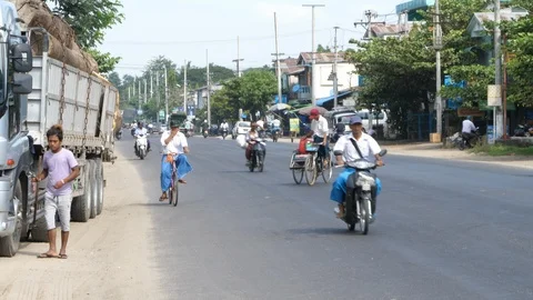 Shan State city, Bycicles and scooters, trafic in Burma, Asia in 4K Stock Footage 94877344