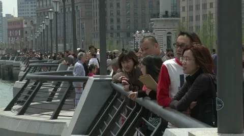 Shanghai Bund people looking at the riverside view Stock Footage 2976235