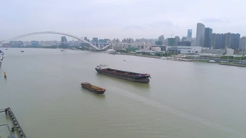 SHANGHAI, CHINA - MAY 7, 2017: Aerial drone view of cargo vessels sailing over Stock Footage 86826641