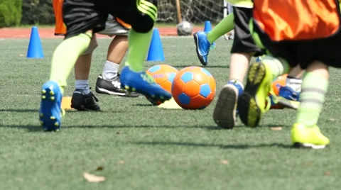 SHANGHAI, CHINA School boy practicing football on playground w Stock Footage 56456166