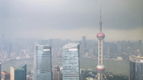 Shanghai city in stormy rain, view of the skyscrapers of Pudong, China Stock Footage