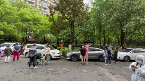 Shanghai Covid lockdown nucleic acid testing in the rain in resident compound 8 Stock Footage 185850970