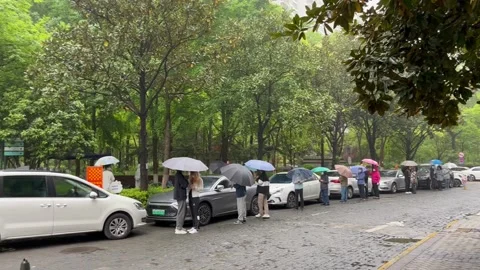 Shanghai Covid lockdown nucleic acid testing in the rain in resident compound 2 Stock Footage 185851145
