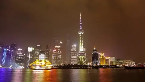 SHANGHAI - MARCH 19, 2018: View of Pudong embankment at night,Brightly Stock Footage 107039084