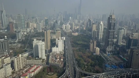 Shanghai multilevel Road Junction traffic cars Skyscraper cityscape modern Drone Stock Footage 90249786
