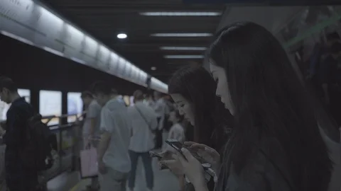 Shanghai subway train, people using phones Stock Footage 113897082