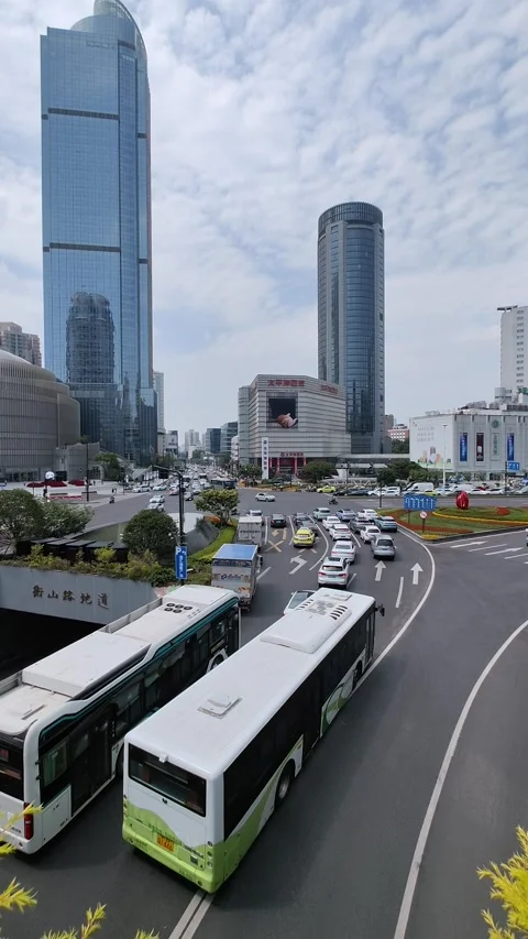 Shanghai Xujiahui area intersection traffic buses cars and skyscrapers 库存影片 249927875