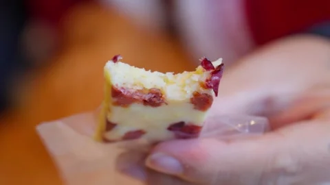 Shangri-La Cranberry Cheese Bite Close-Up — Creamy Texture and Cultural Flavor Stock Footage 312586091