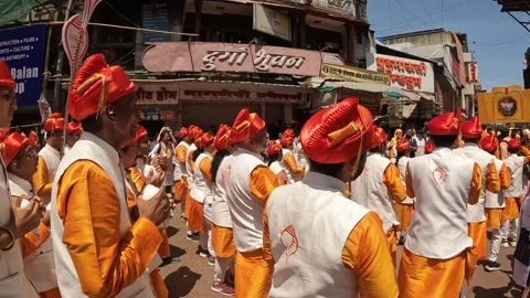 Shankhnaad, performs with hundreds of conch blowers. during Ganesh visarjan Stock Footage 285334666
