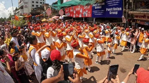 Shankhnaad, performs with hundreds of conch blowers. during Ganesh visarjan Stock Footage 285334973