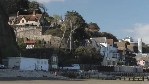 Shanklin seafront from Luccombe end, cliff lift in distance, beach huts etc,  Stock Footage 238726169