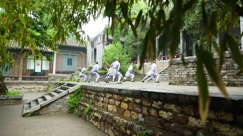 Shaolin monks practicing stick fighting Stock Footage 88677412