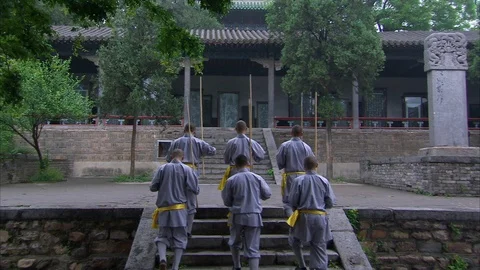 Shaolin monks practicing stick fighting Stock Footage 89761944