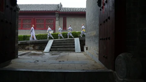 Shaolin monks running on the slope while Kung fu training Stock-Footage 88676901