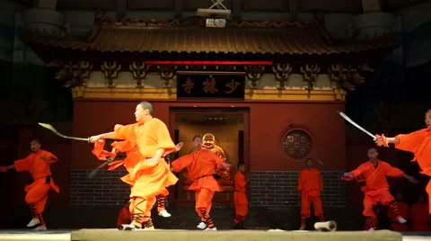 Shaolin temple monks are practicing martial skills on the stage for the tourists Stock Footage 58707685