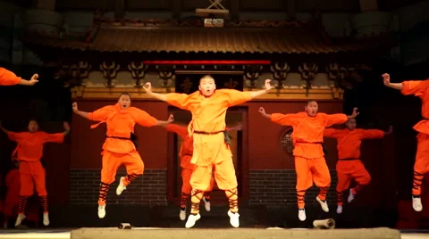 Shaolin temple monks are practicing martial skills on the stage for the tourists Stock Footage 58709378
