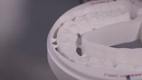 The shape of the artificial teeth is made on a CNC dental milling machine. Video stock 263728464