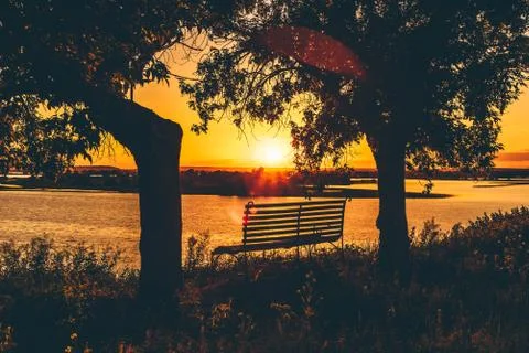 Shape of Bench by the River. Stock Photos