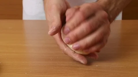 Shape the dough into a ball. Making Puff Pastry Series. Stock Footage 77222479