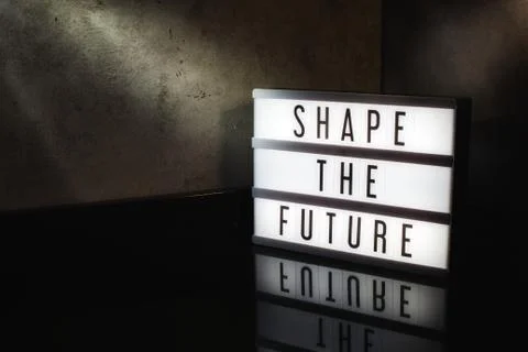 Shape the future motivational message of progress on a light box Stock Photos