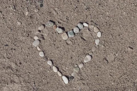 Shape of a heart on a beach Stock Photos