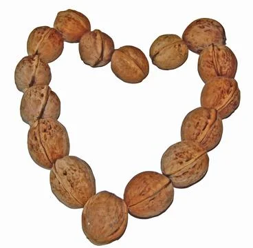 The shape of a heart made of several walnuts Stock-Fotos