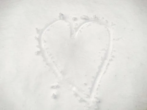 The shape of a heart made of snow - winter Stockfoto's