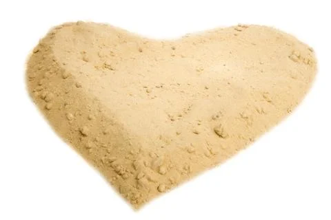 Shape of heart into a sand Stock Photos