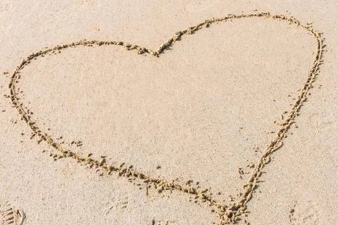 Shape of heart on sand Stock Photos