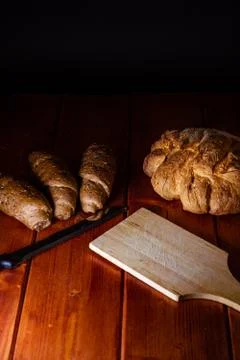  shape of homemade bread and bread with cereals and cutting board  Stock Photos