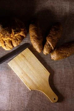  shape of homemade bread and bread with cereals and cutting board  Stock Photos