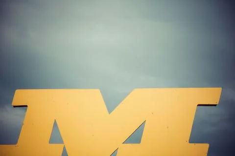 Shape of letter m in front of heavy sky Stock Photos