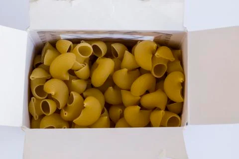 Shape pasta in own box on white background with copy space,top view. Stock Photos