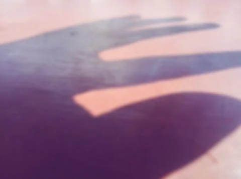 The shape of the shadow from a finger, defocused Stock Photos