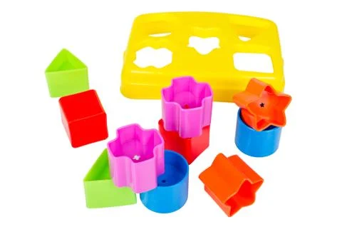 Shape sorter toy with various coloured blocks isolated Stock Photos