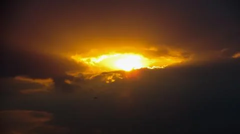 The shape of the sun and clouds looks like a burning eye in the sky Stock Photos