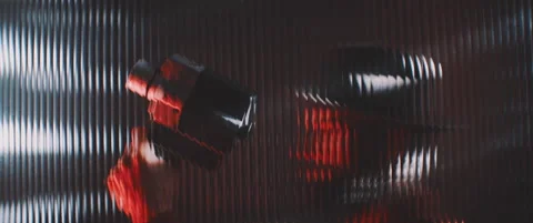 Shape of a vintage camera thorugh shaped clear panel in red lights Stock Footage 203570746