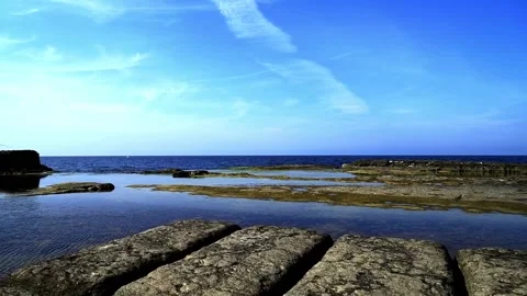 Shaped clouds and rocks Stock Footage 167584997