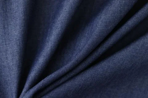 Shaped grey-blue textile as background. Stock Photos