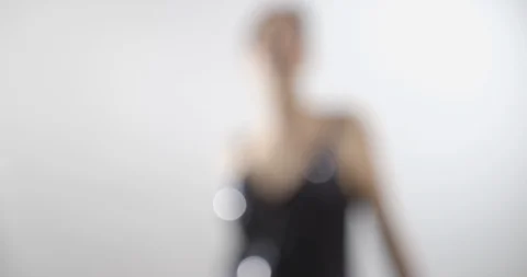 A shapely woman is trying on an elegant sequined dress - lifestyle concept Vídeo Stock 103805334