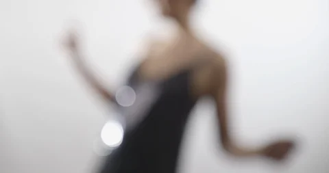 A shapely woman is trying on an elegant sequined dress - lifestyle concept Vídeo Stock 104089236