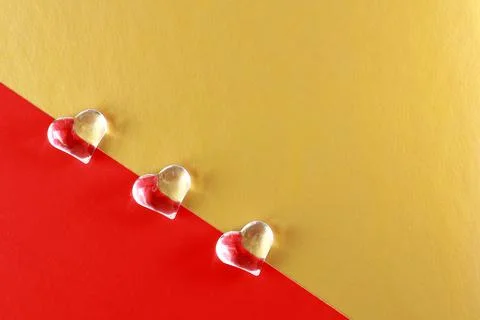 Shapes of hearts on a colored background. Stock Photos