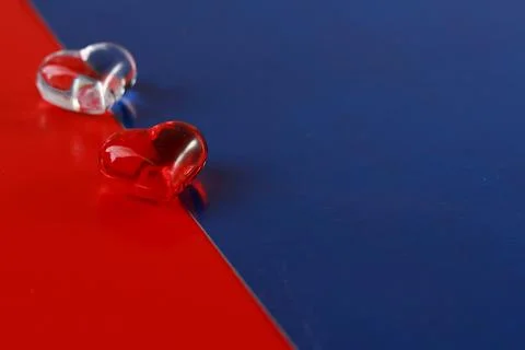 Shapes of hearts on a colored background. Stock Photos