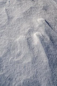 Shapes, textures, patterns created by snow and wind. Stock Photos