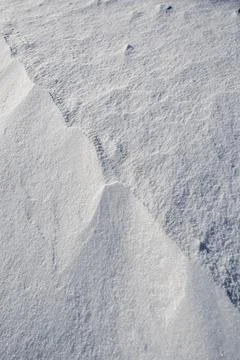 Shapes, textures, patterns created by snow and wind. Stock Photos