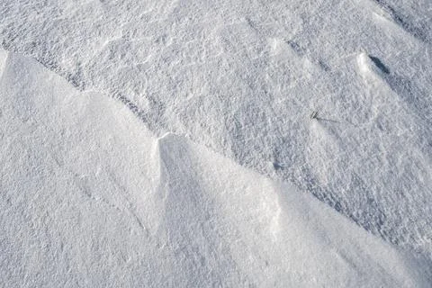 Shapes, textures, patterns created by snow and wind. Stock Photos
