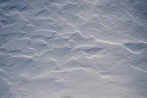 Shapes, textures, patterns created by snow and wind. Stock Photos