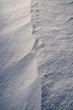 Shapes, textures, patterns created by snow and wind. Stock Photos